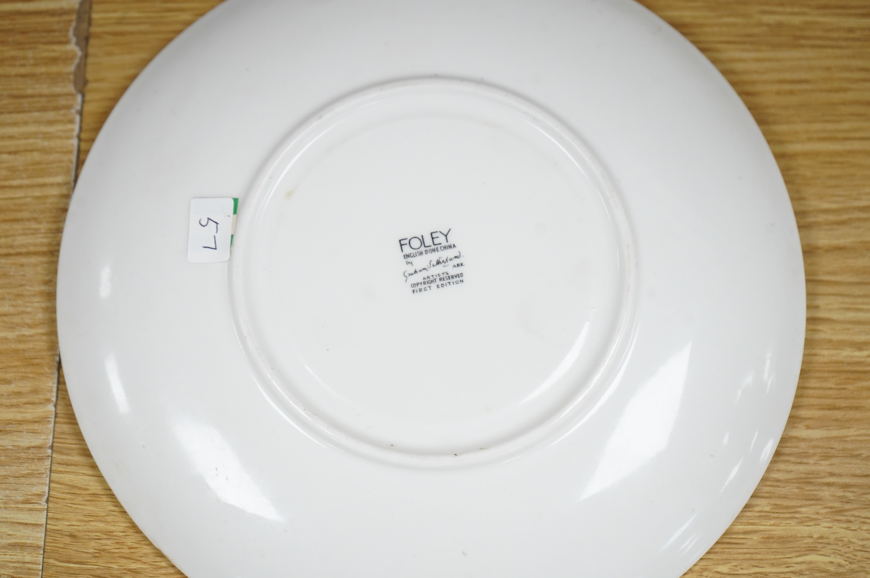 Laura Knight for Foley China cupid plate and matching side plate, together with a Graham Sutherland for Foley China plate and matching side plate, largest 23cm in diameter